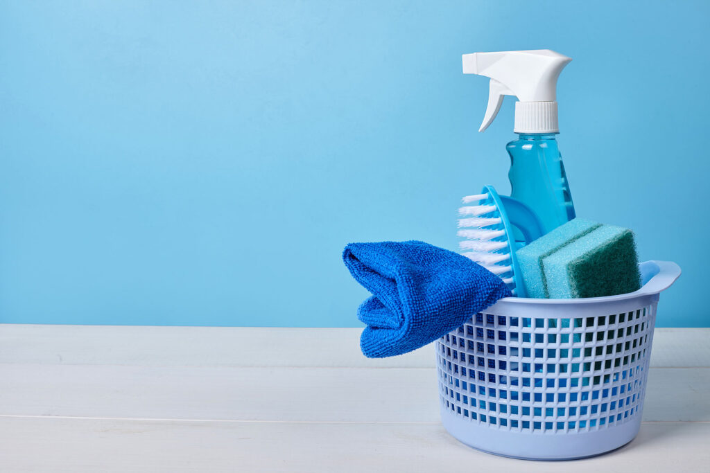 blue cleaning supplies with blue background
